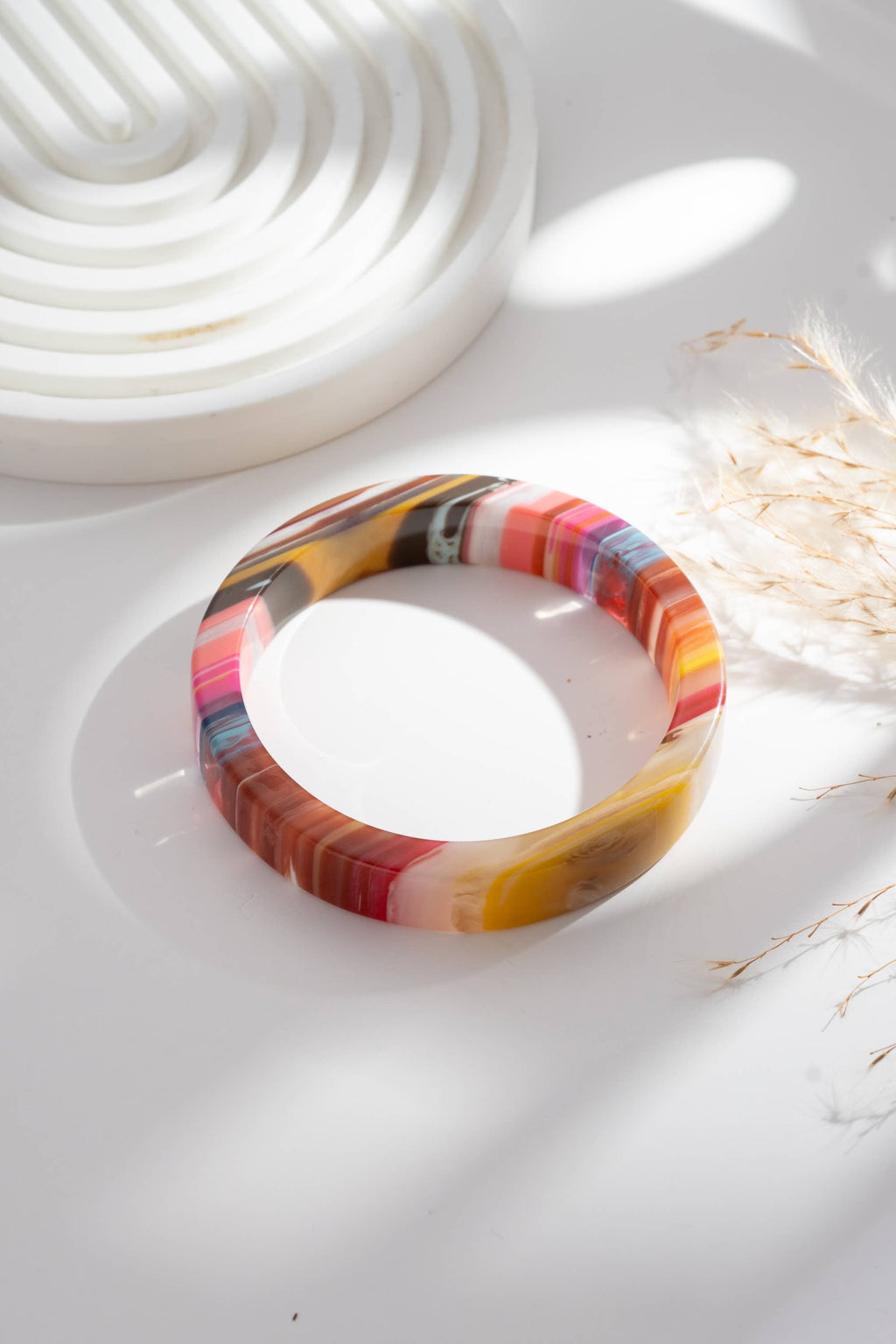 Set of two chic multicolored resin bracelets, round and rectangular