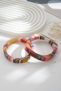 Set of two chic multicolored resin bracelets, round and rectangular