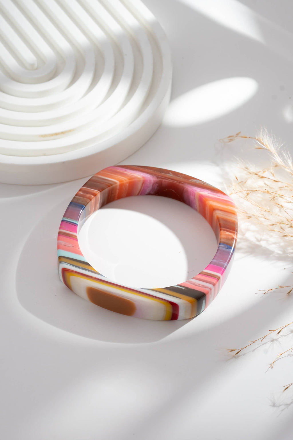 Set of two chic multicolored resin bracelets, round and rectangular
